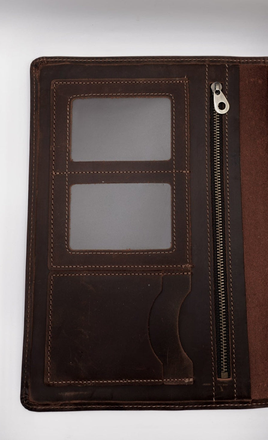 Brown leather planner cover with zipper on a white background